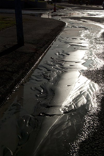 IMGP6018.jpg - Then on June 13th we had a pair of earthquakes about an hour apart, a 5.8 followed by a 6.4.  So more liquefaction came up.  This is about the worst of it from our area but once again the people out east had to dig out thousands of tons of it, with still more to come in December.  Many of them are fed up and while their houses are in the "green zone" they are sick of shovelling and want to be redesignated to "red zone" so they can qualify for the Government buyout package and move out.Some buildings sustained further damage in the June quakes but they were mostly ones that were already cordoned off and marked for demolition.  We were back at work the following day.