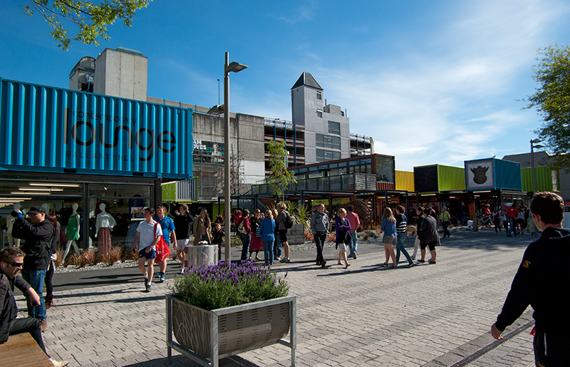IMGP6520.jpg - Shipping containers are a very common sight around our city now.  Mostly they have been stacked in front of unstable rock faces to protect people and roads from falling rocks.  They've also been stacked in front of historic building facades in an attempt to preserve them so they can be reused when rebuilding.Pictured here is Cashel Street Mall, formerly an outdoor shopping area filled with lovely old historic buildings.  These all suffered serious structural damage so were demolished.  In an effort to get people back into the city centre, and as a bit of a feel-good project to give us something to look forward to, the authorities chose to create a shopping centre out of shipping containers, to be ready by Show Weekend in November.  It's proved to be quite popular.  The lack of surrounding buildings makes the space feel very open.