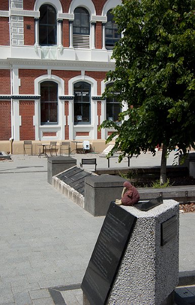 IMGP6657.jpg - This kiwi appears to be snoozing.  They are nocturnal, after all.  The old Post Office building in the background had extensive seismic strengthening several years ago which paid off - it will be repaired and reopened.