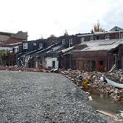 The back of the shops on High St.  Looks a bit third-world with the open drain.